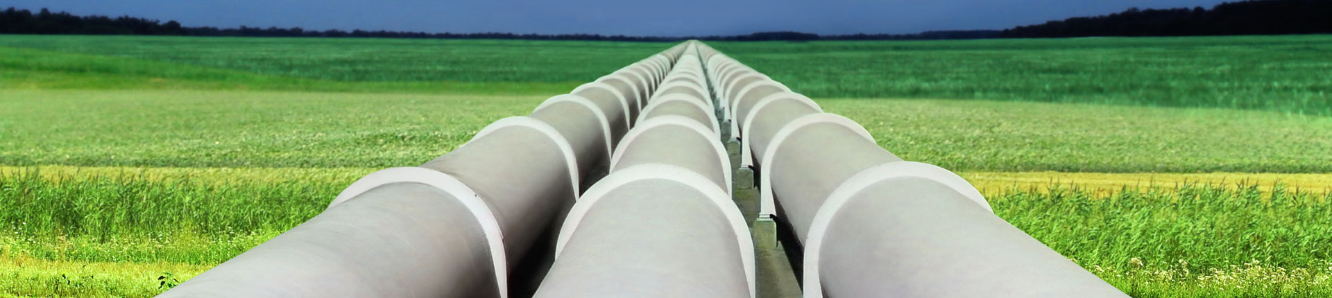 3 large pipelines in a green filed